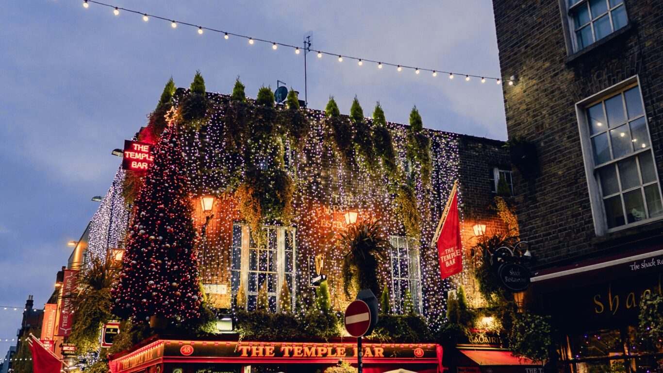 Dublin city, Ireland – 12.11.2021: Amazing Temple bar illuminated and decorated for Christmas. Night scene. Town iconic landmark and tourists attraction.